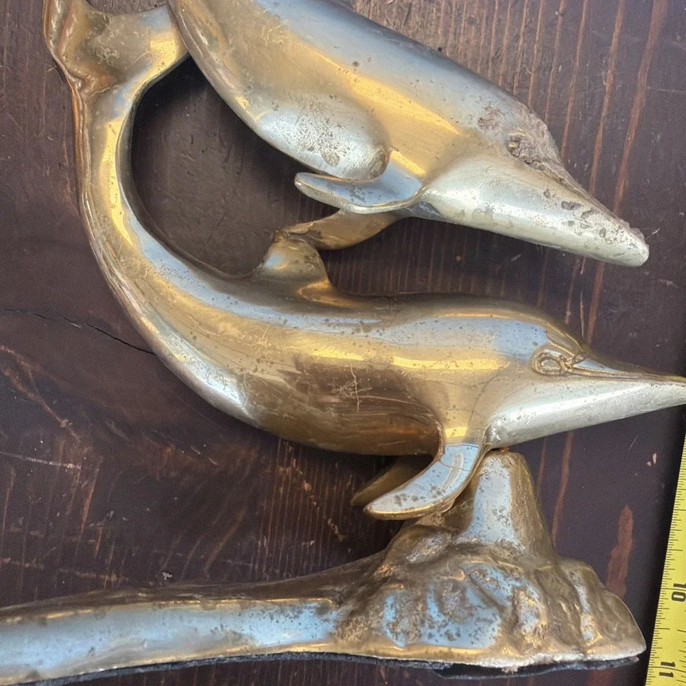 brass dolphin sculpture